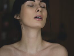 Topless Woman Closing Her Eyes