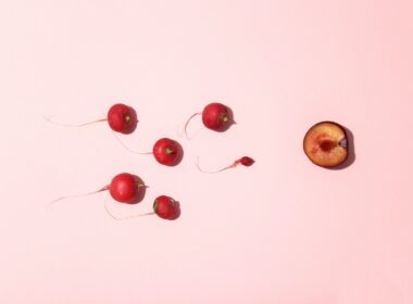 red cherry fruits on white surface