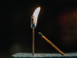 shallow focus photography of lighted matchstick